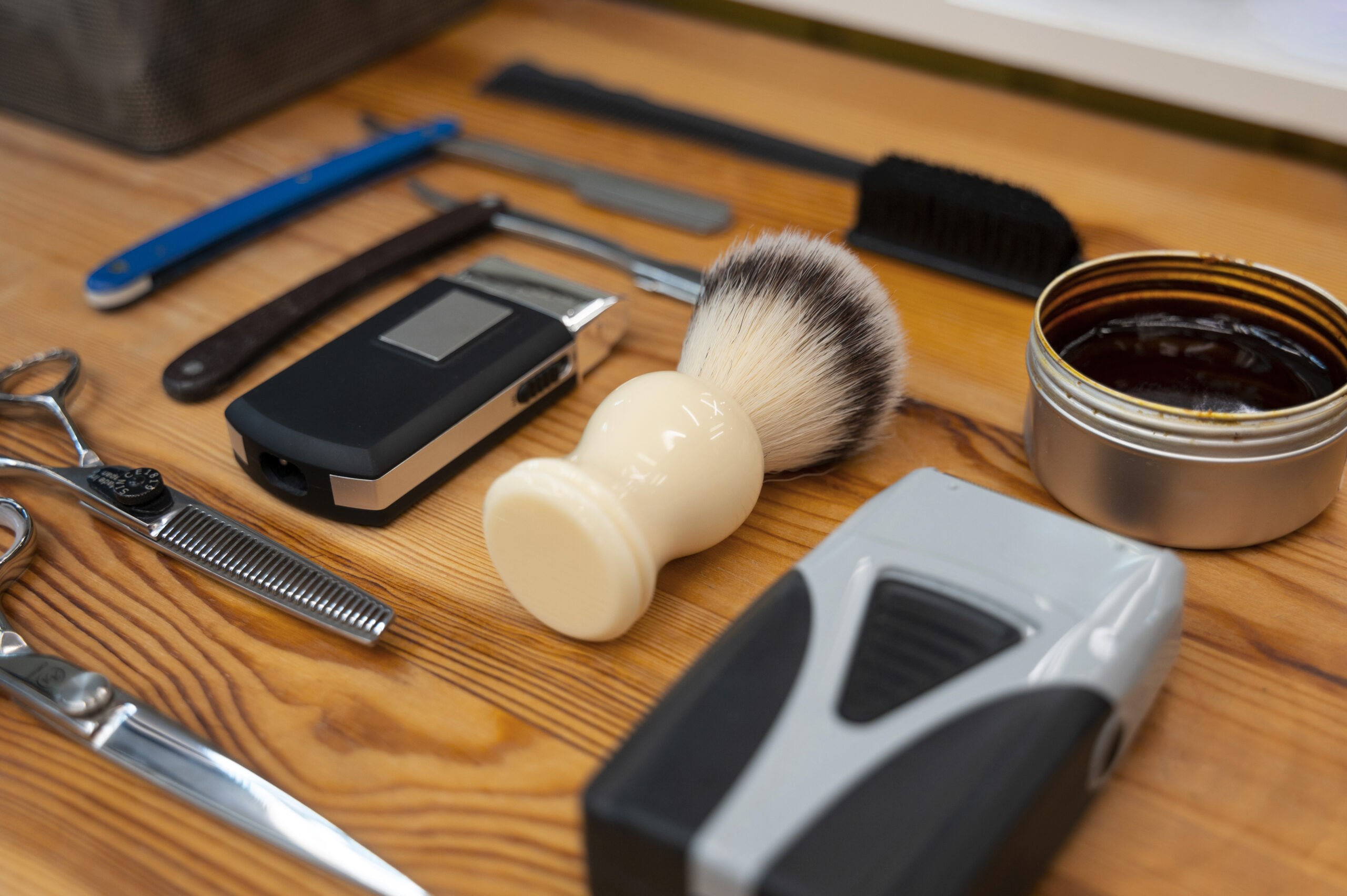 A lineup of beard care products for men, including beard oil, balm, butter, wax and wash